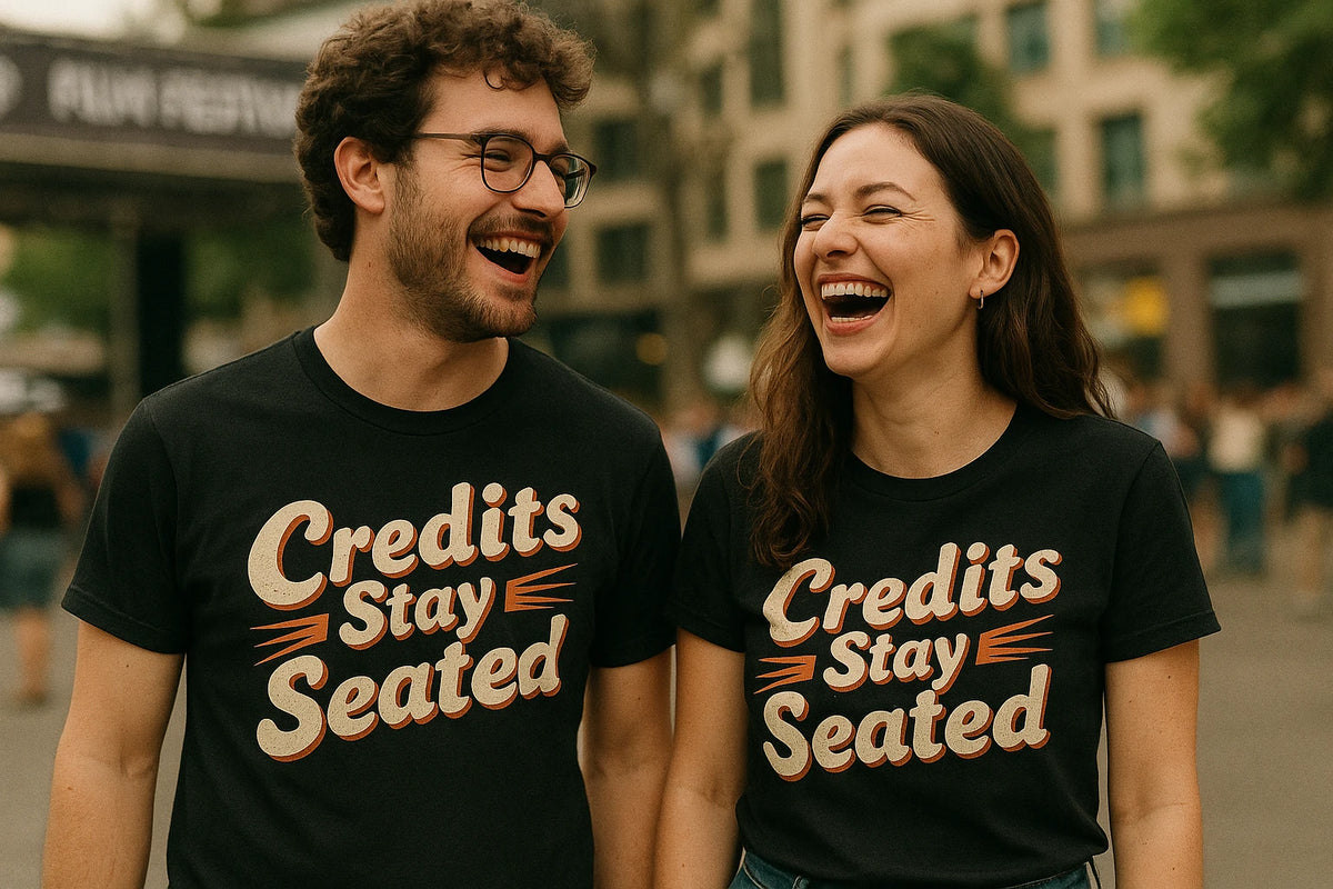 Person wearing the black graphic tee graphic tee - "Credits Stay Seated" design