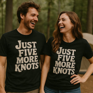 Person wearing the black bushcraft t shirt graphic tee - "Just Five More Knots" design
