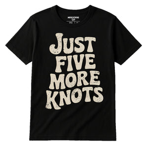 Black Bushcraft T Shirt - "Just Five More Knots" graphic tee with beige print, flat lay product photo