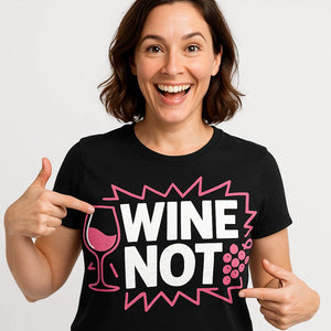 Close-up of the "Wine Not" white print on a premium Bella+Canvas black wine t shirt