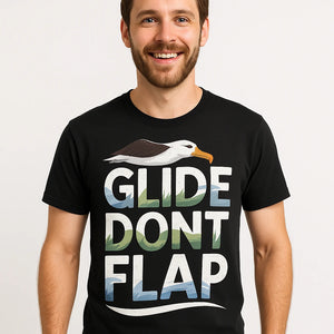 Close-up of the "Glide Dont Flap" white print on a premium Bella+Canvas black albatross t shirt