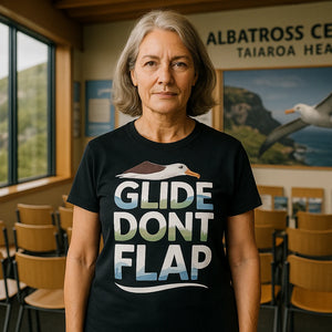 Lifestyle shot of the "Glide Dont Flap" black albatross t shirt in a real-world setting