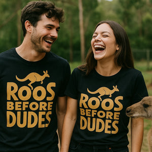 Person wearing the black kangaroo pocket t shirt graphic tee - "Roos Before Dudes" design