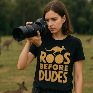 Lifestyle shot of the "Roos Before Dudes" black kangaroo pocket t shirt in a real-world setting