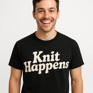 Close-up of the "Knit Happens" cream print on a premium Bella+Canvas black knitted t shirt womens
