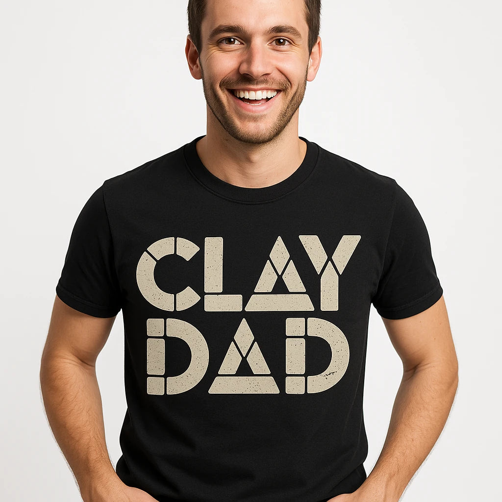 Close-up of the "Clay Dad" light gray print on a premium Bella+Canvas black body sculpting t shirt