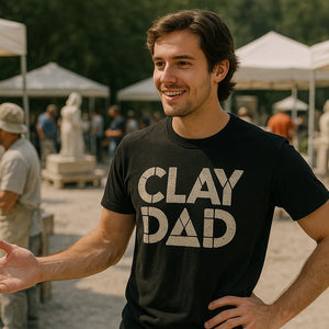 Lifestyle shot of the "Clay Dad" black body sculpting t shirt in a real-world setting