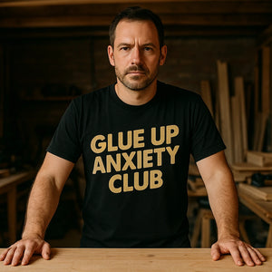 Lifestyle shot of the "Glue Up Anxiety Club" black woodworking t shirts funny in a real-world setting