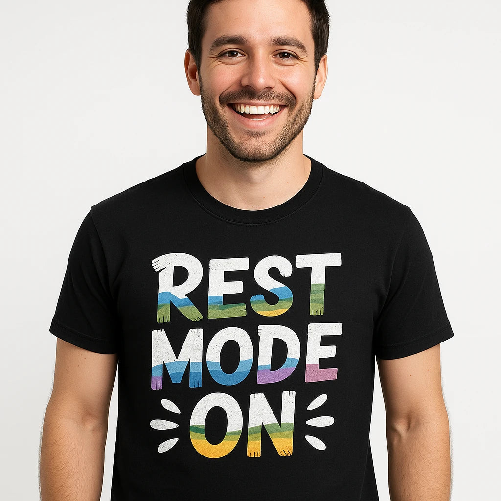Close-up of the "Rest Mode On" white print on a premium Bella+Canvas black relaxing t shirt