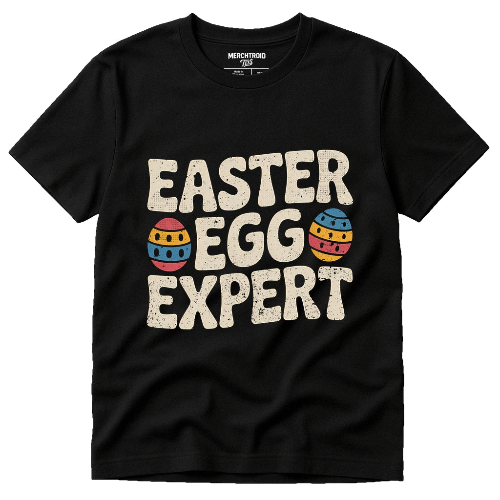 Black Easter Shirts - "Easter Egg Expert" graphic tee with beige print, flat lay product photo