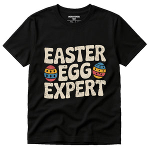 Black Easter Shirts - "Easter Egg Expert" graphic tee with beige print, flat lay product photo