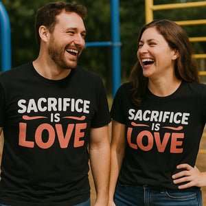 Person wearing the black mom life tee graphic tee - "Sacrifice Is Love" design
