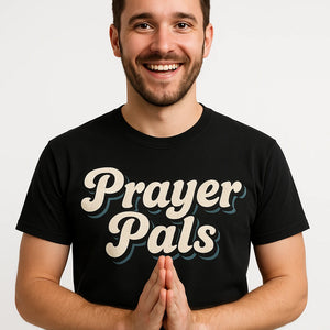 Close-up of the "Prayer Pals" beige print on a premium Bella+Canvas black faith over fear t shirt