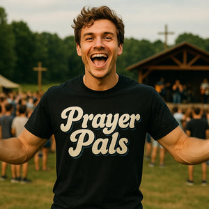 Lifestyle shot of the "Prayer Pals" black faith over fear t shirt in a real-world setting
