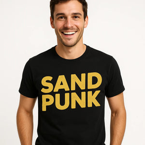 Close-up of the "Sand Punk" yellow print on a premium Bella+Canvas black sandboarding t shirt