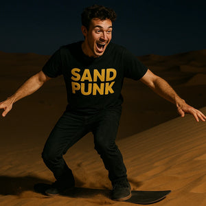 Lifestyle shot of the "Sand Punk" black sandboarding t shirt in a real-world setting