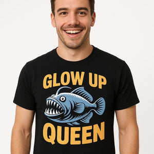 Close-up of the "Glow Up Queen" gold print on a premium Bella+Canvas black anglerfish shirts