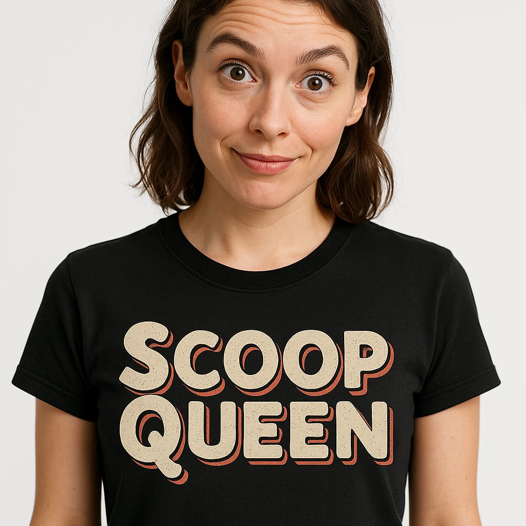 Close-up of the "Scoop Queen" beige print on a premium Bella+Canvas black journalist t shirt
