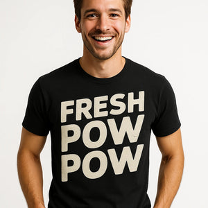 Close-up of the "Fresh Pow Pow" light gray print on a premium Bella+Canvas black skiing shirts