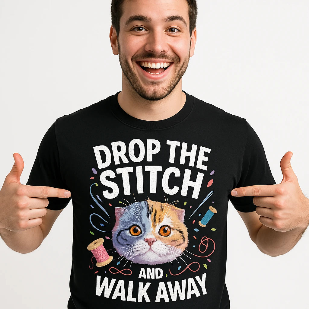 Close-up of the "Drop the Stitch and Walk Away" white print on a premium Bella+Canvas black t shirt sewing pattern