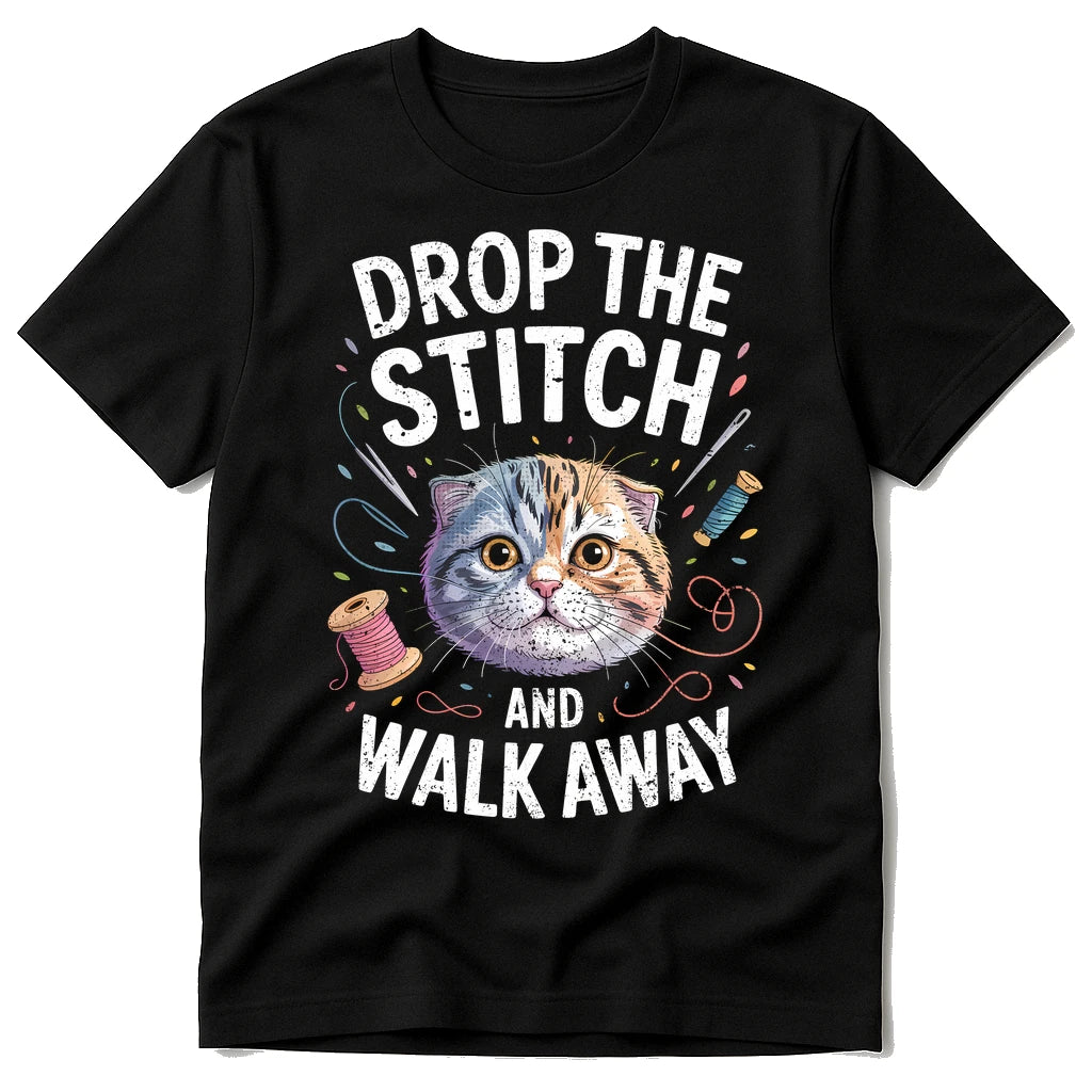 Black T Shirt Sewing Pattern - "Drop the Stitch and Walk Away" graphic tee with white print, flat lay product photo