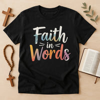 A flat lay image featuring a black t-shirt with the text 
