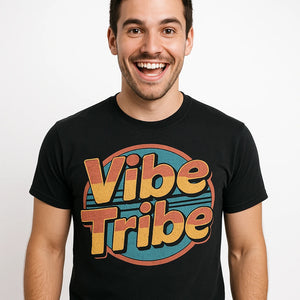 Close-up of the "Vibe Tribe" orange print on a premium Bella+Canvas black socializing shirts