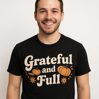 A person is smiling while wearing a black T-shirt with the words 