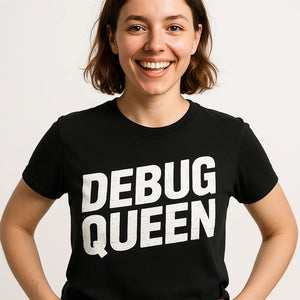 Close-up of the "Debug Queen" white print on a premium Bella+Canvas black game developer t shirt