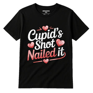 Black Relationships Shirts - "Cupid’S Shot Nailed It" graphic tee with pink print, flat lay product photo