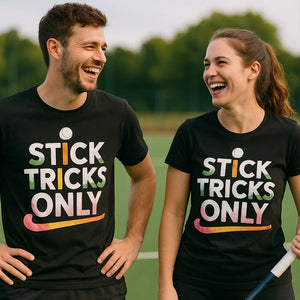Person wearing the black field hockey sweatshirt graphic tee - "Stick Tricks Only" design