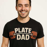 A person wearing a black t-shirt with the text 