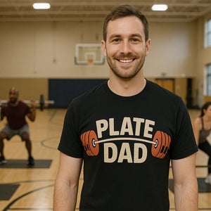 Lifestyle shot of the "Plate Dad" black weightlifting tee shirts in a real-world setting