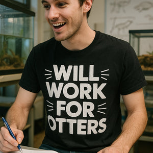 "Will Work for Otters" black zoology t shirt, photographed as gifts for zoology lovers