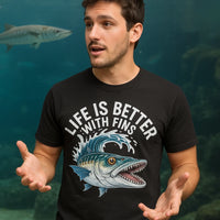 A person wearing a black T-shirt with a colorful graphic of a fish and the text 