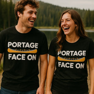 Person wearing the black canoeing shirts graphic tee - "Portage Face On" design