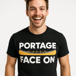 Close-up of the "Portage Face On" white print on a premium Bella+Canvas black canoeing shirts