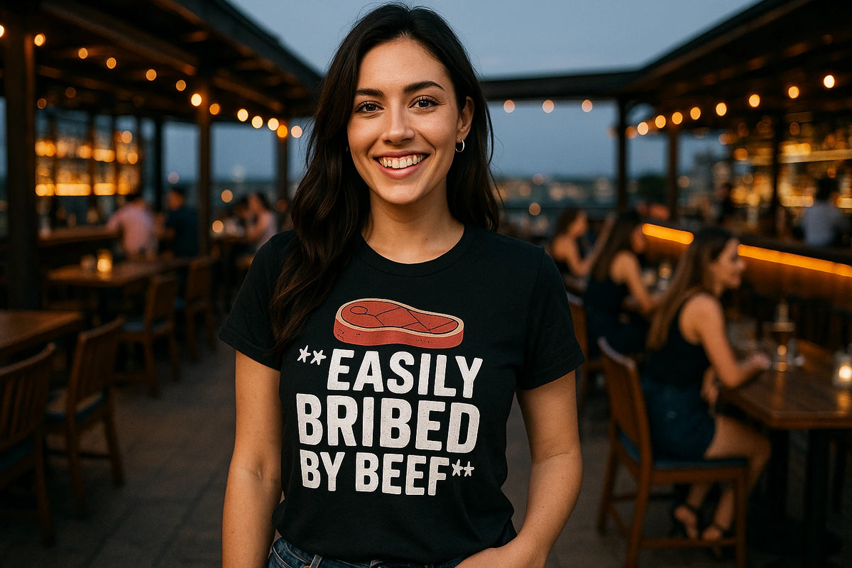 Lifestyle shot of the "Easily Bribed By Beef" black steak shirts in a real-world setting
