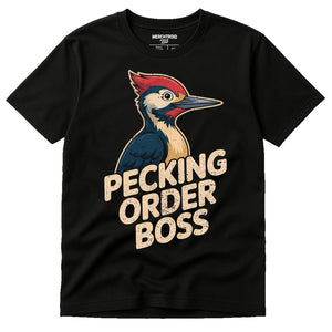 Black Woodpecker T Shirt - "Pecking Order Boss" graphic tee with beige print, flat lay product photo