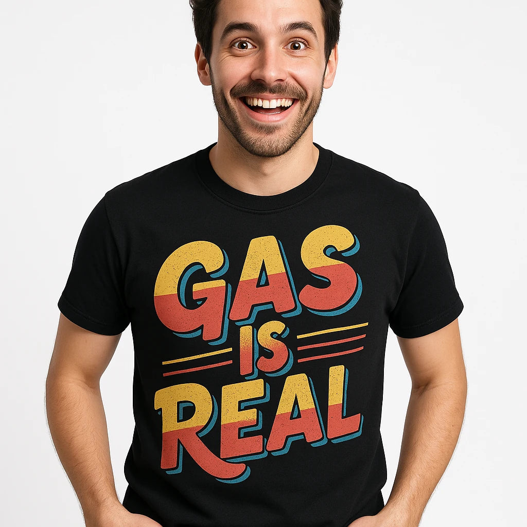 Close-up of the "Gas Is Real" orange print on a premium Bella+Canvas black musician t shirt