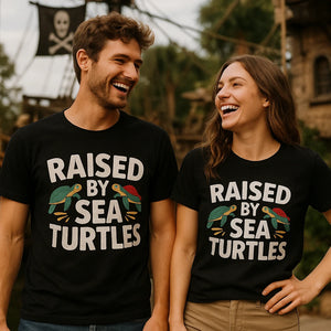 Person wearing the black pirate shirts for ladies graphic tee - "Raised By Sea Turtles" design
