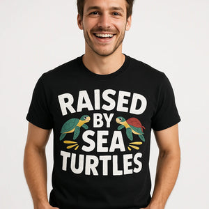 Close-up of the "Raised By Sea Turtles" white print on a premium Bella+Canvas black pirate shirts for ladies