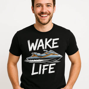 Close-up of the "Wake Life" white print on a premium Bella+Canvas black skiing t shirt