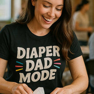 "Diaper Dad Mode" black diaper duty shirts, photographed as diaper duty lover gift