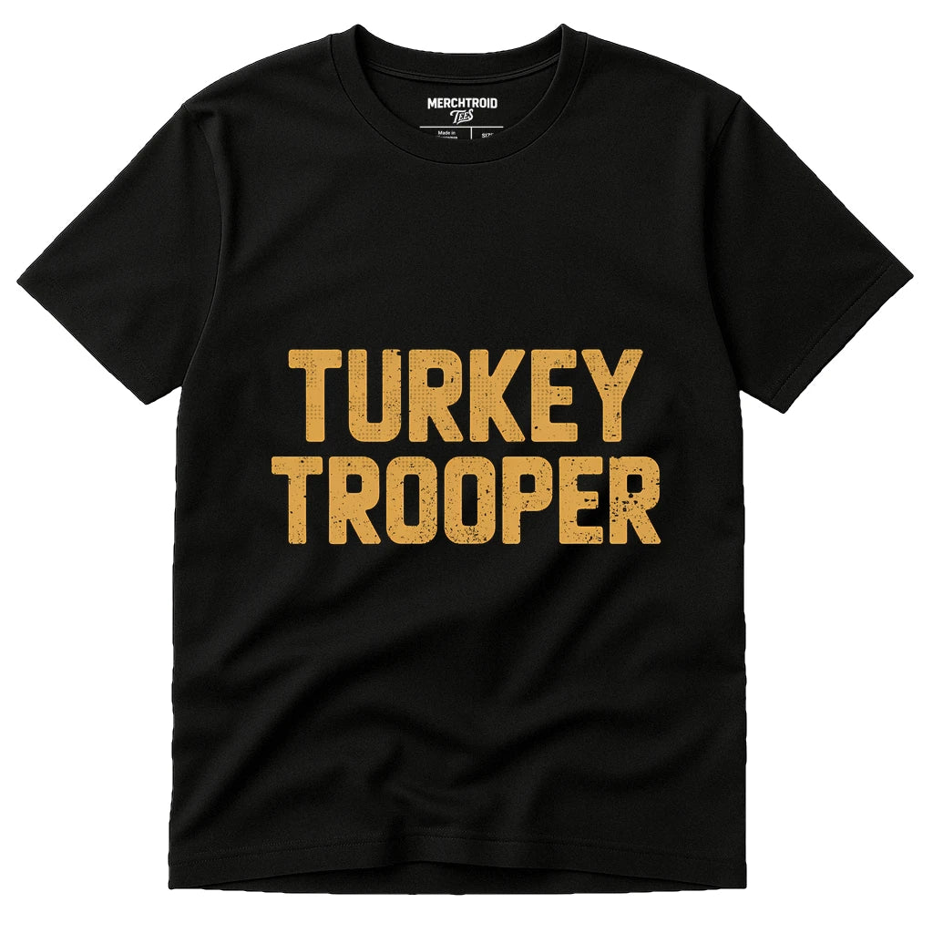 Black Funny Thanksgiving T Shirts - "Turkey Trooper" graphic tee with gold print, flat lay product photo