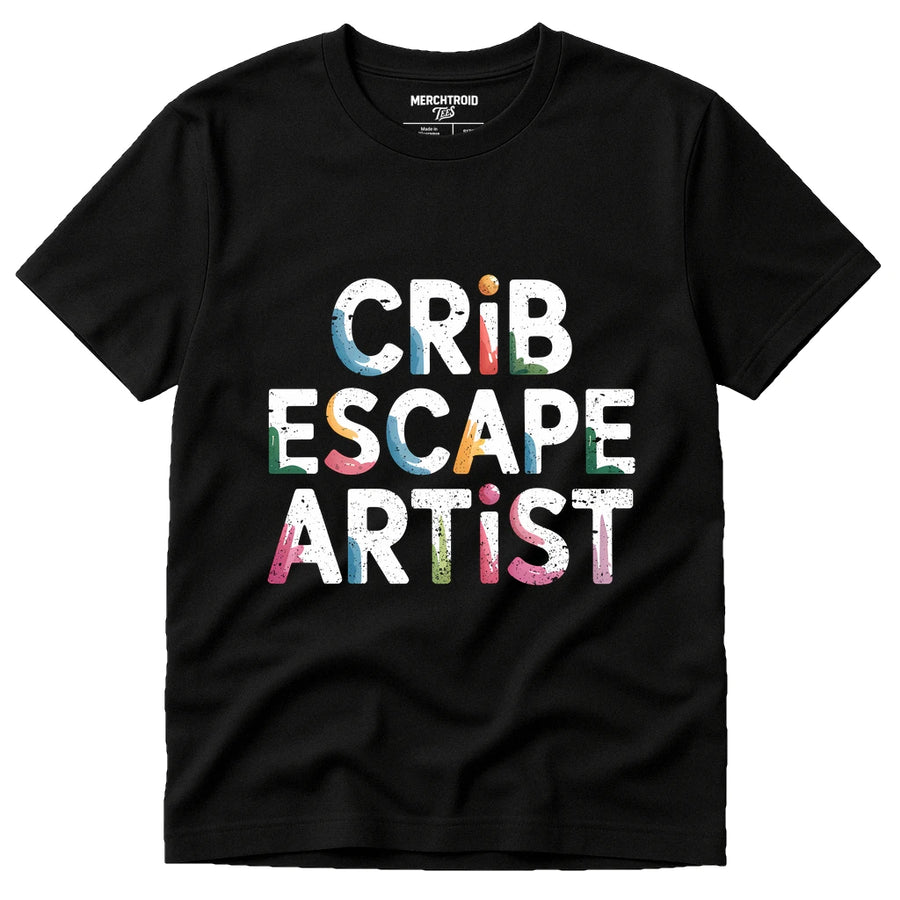A black t-shirt with large, colorful, distressed font text reading "CRIB ESCAPE ARTIST" on the front. The shirt is displayed against a white background.