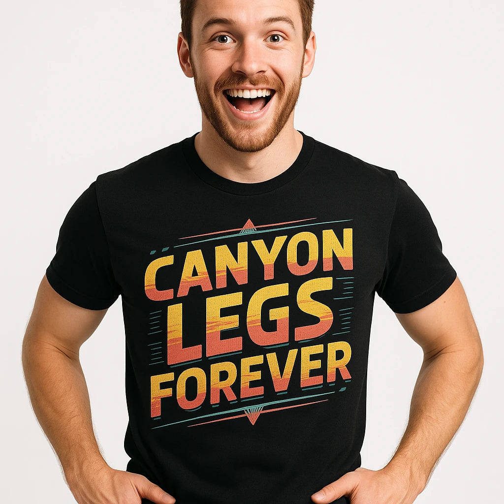 Close-up of the "Canyon Legs Forever" gold print on a premium Bella+Canvas black the grand canyon t shirt