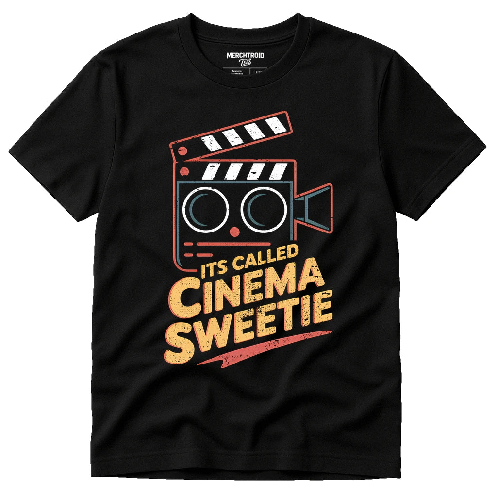 Black Film Director T Shirt - "Its Called Cinema Sweetie" graphic tee with gold print, flat lay product photo