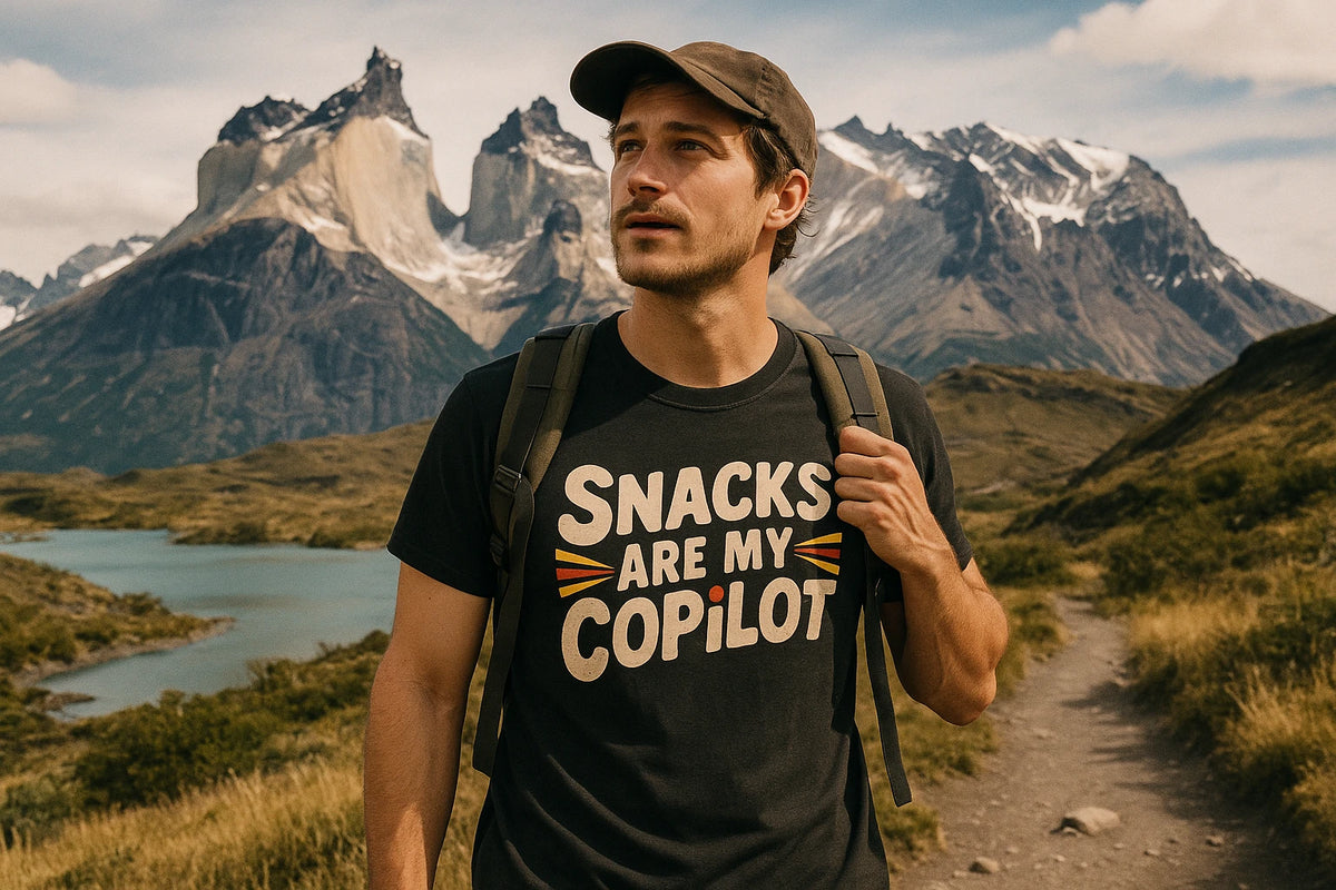 Lifestyle shot of the "Snacks Are My Copilot" black adventure t shirt in a real-world setting