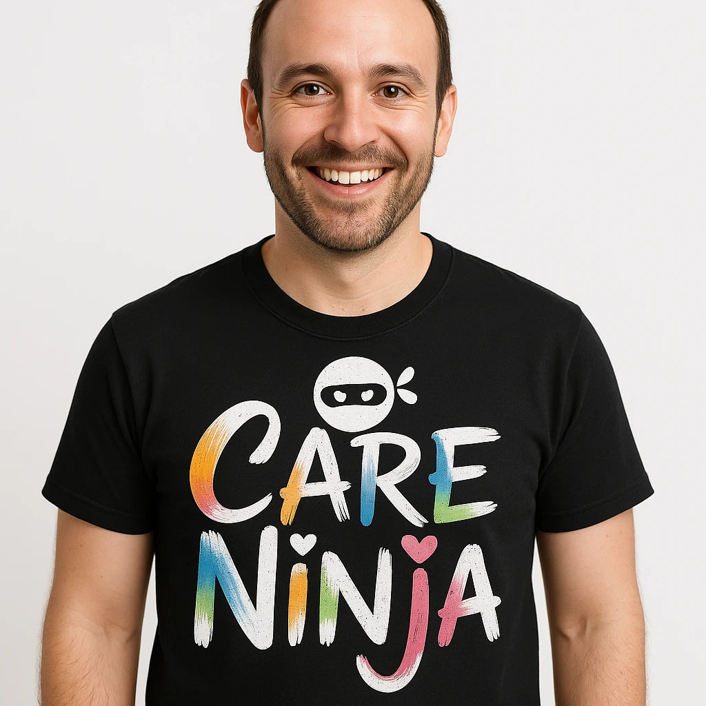 Close-up of the "Care Ninja" white print on a premium Bella+Canvas black social worker shirts